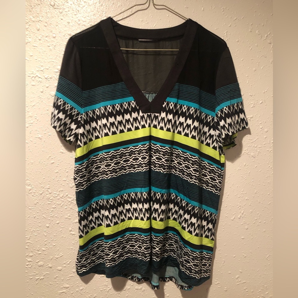 Polyester sheer short sleeve blouse. Tag cut out but fits like XL